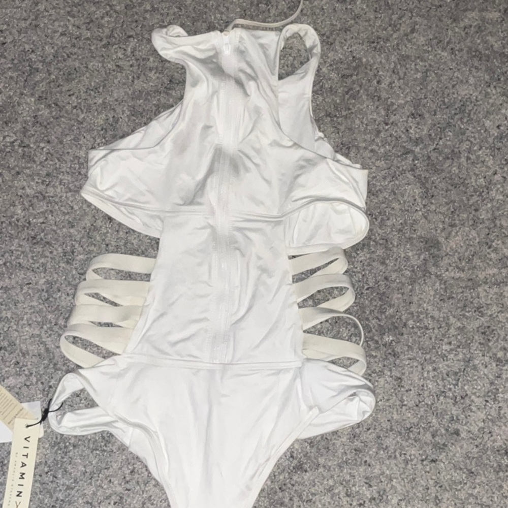 White swimsuit zipper up the back